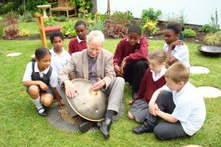 Rev Philip Broderick demonstrates hang drum during Quiet Garden launch - image JS