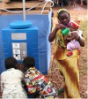 families draw water from street tank in Nairobi