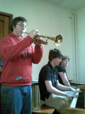 James plays Giovanni's trumpet; Simon on piano