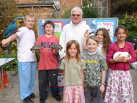 Pictured l-r Tony with parrot Precious, Andrew, Matylda, Fr Tom, Michael, Marie, Cecylia.