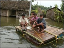 flood survivors on makeshift raft
