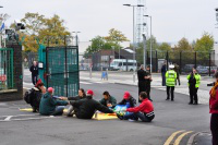 demonstrators link hands in prayer