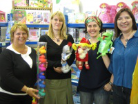 students show some of the colourful toys they will take to Thailand