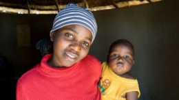Beauty Moyo, 19, with her son Thamsanqu -supported by CAFOD