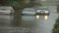 cars edge their way along one of the last open roads