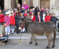 Archbishop Vincent with children and Larry the donkey
