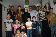 Fuad's family with his picture
