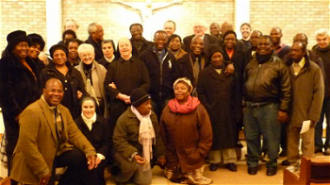 Prof Houlden in back row with Fr Martin, Fr Clive, Rev Tunde and Rev Claude with parishioners