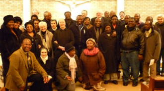 Prof Houlden in back row with Fr Martin, Fr Clive, Rev Tunde and Rev Claude with parishioners