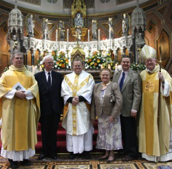 Fr Roger Peck with Archbishop Longley; Fr Cross, Parish Priest, his parents Windsor and Rosa and brother William Pic: Peter Jennings