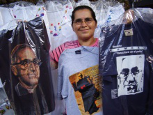 Oscar Romero's face is everywhere in El Salvador - on murals, T shirts, and keyrings. The T shirt on the right bears the inscription: 'I will rise again in the people'