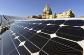 St Peters on horizon with solar panels on roof of Pope Paul VI Hall