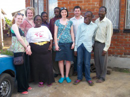 Natalie Crouch, Sophie Le Breton, teachers Mrs Crossley, Mr Warrilow, with Kundai and his family