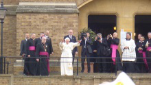 Pope greets childen before going into St Mary's chapel