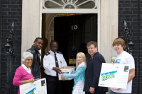 David Harewood (left) with CAFOD director Chris Bain and campaigners at Number 10