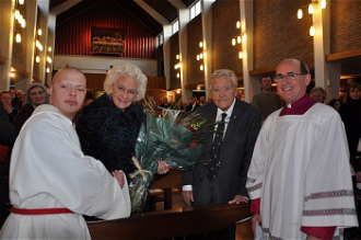 l-r Alex presenting flowers, Lady Morris, Lord Morris, Canon Pat Browne (pic - Archdiocese Westminster) 