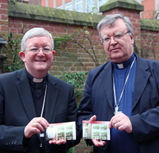    Archbishop Longley and Bishop Kenney with the commemorative stamps on Friday.   Picture by Peter Jennings