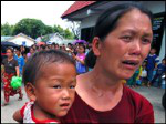 Hmong mother & child flee army