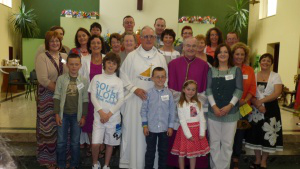 Fr Joe, Bishop George with family and friends