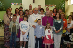 Fr Joe, Bishop George with family and friends