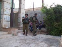 Soldiers guardng children during another incident in Hebron recently