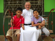 Fr Mike with two blind children
