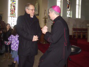 Bishop John chats with parishioner Mike Boyes after Mass 
