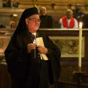 Bishop Zakaria lights candles for those who have been killed for their Christian Faith.