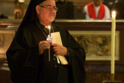 Bishop Zakaria lights candles for those who have been killed for their Christian Faith.