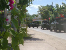 armoured vehicles outside bishop's residence