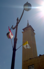Mosque behind lamppost festooned with flags for Papal Visit - pic - M Glackin