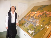 Sr Mary with model of St George's Park Retirement VIllage