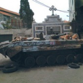 Tank outside church in Syria. 