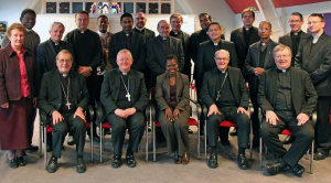 Front row: l - r Bishop David McGough, Archbishop Bernard Longley, Ms Cecilia Taylor-Camara, Bishop Alan Hopes, Bishop William Kenney CP 