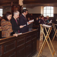 Marie Dennis (centre) Ambassador Romero (right) during service