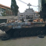 tank outside Syrian church  