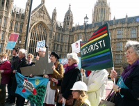 Pax Christi, CAAT,  MAW members protest outside Parliament