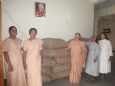 Sisters with their first harvest