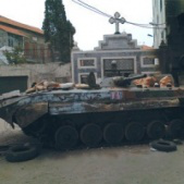 tank outside Syrian church