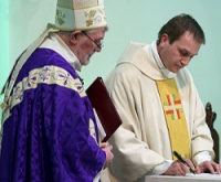Happier times: Bishop Patrick inducts Fr Michael as parish priest - Feb 2013