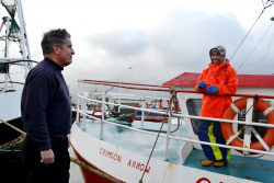 AoS chaplain greets crew member