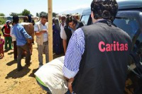 Caritas Lebanon distributes aid to Syrian refugees in camp in Bekaa Valley.  Credits: Eoghan Rice / Trócaire