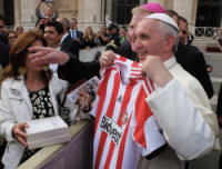 Pope holds shirt presented to him by Fr Marc Lyden-Smith, Sunderland Football Club's chaplain
