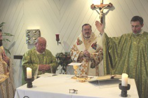 Archbishop Nassar (2nd left) during Mass at ACN headquarters in Germany last week