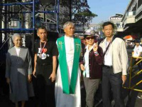 Fr Vichal with colleagues at protest