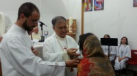 Patriarch distributes Communion