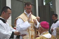  Fr. Kenneth Walker, FSSP gives a first blessing to Bishop Bruskewitz in 2012