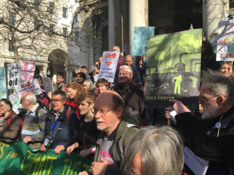 Fr Peter Hughes (centre) before the march