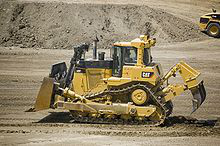 "CatD9T" by Shaun Greiner - CAT D9T. Licensed under CC BY-SA 2.0 via Wikimedia Commons -