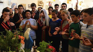 Young Syrians at prayer